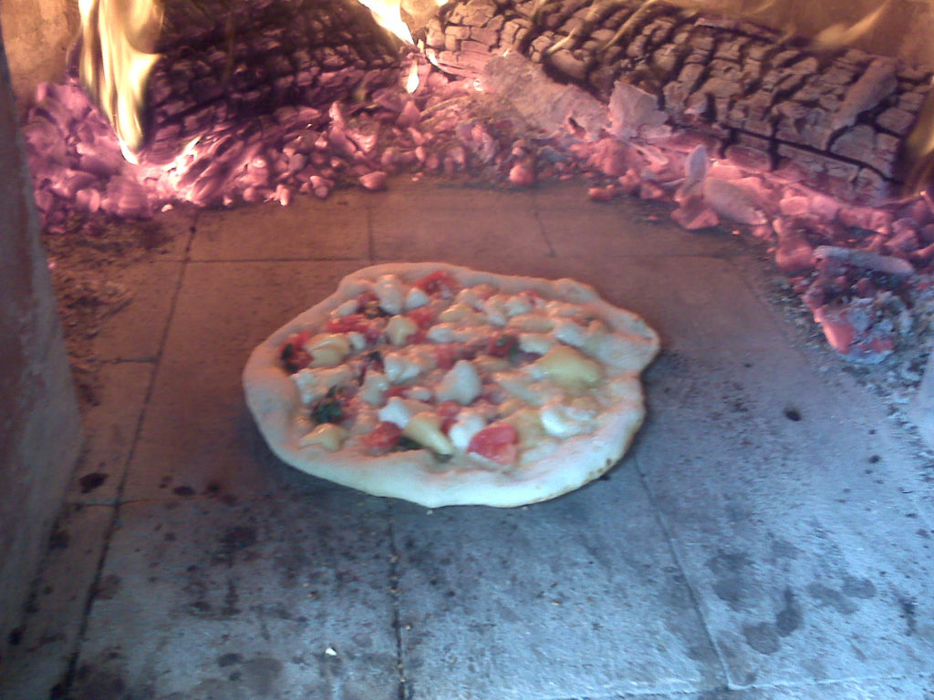 New pizza in oven